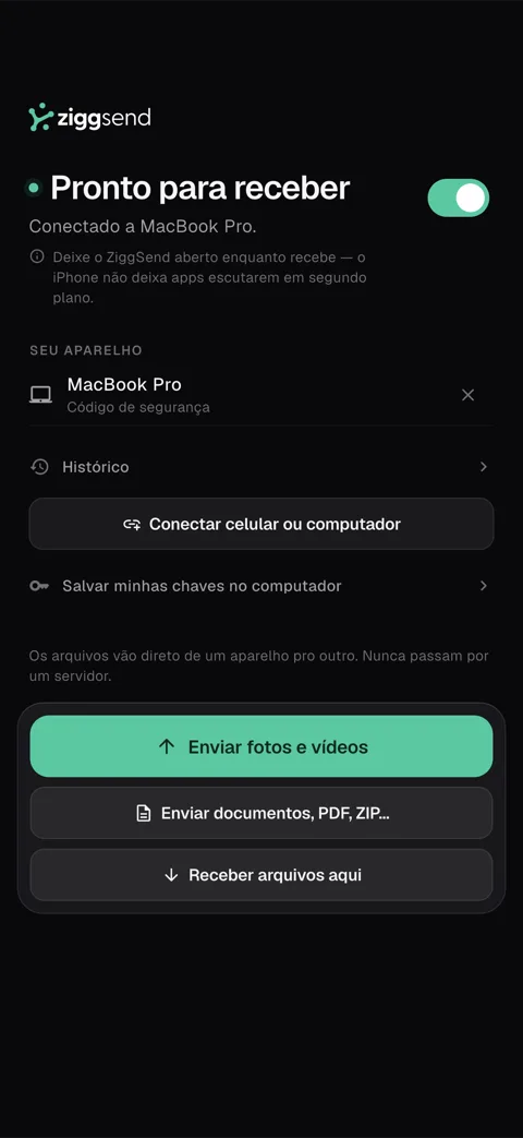App do ZiggSend no iPhone, conectado a um MacBook Pro, com o botão Enviar fotos e vídeos